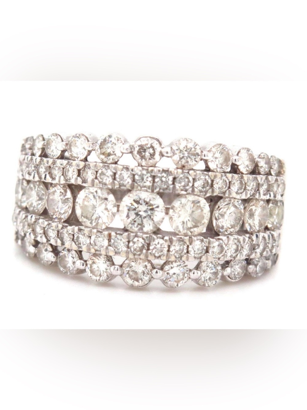 Stunning 14k white gold ring with 5 rows of diamonds of varying sizes.